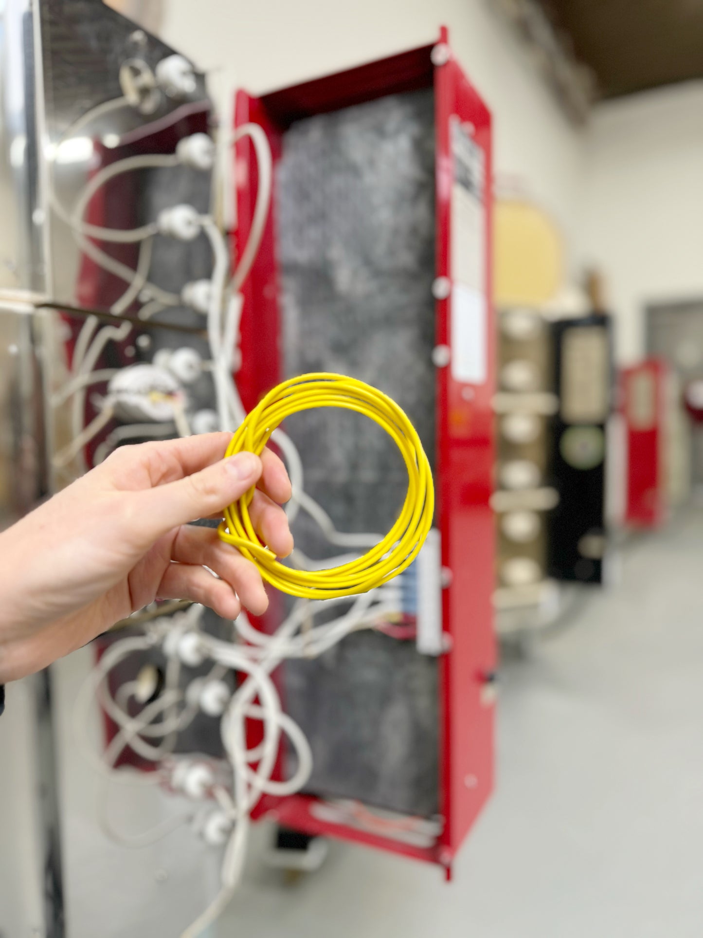 Thermocouple wire used to connect Yellow (+) and Red (-) ends of the wire to the a Type-K Thermocouple with a mounting block. Thermocouple wire is a special pair of dissimilar metal wires that connect a thermocouple sensor to the kiln controller, carrying the tiny voltage signal generated by the temperature difference without adding significant resistance or interference, and often rated to withstand the high temperatures inside the kiln.
